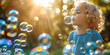 © DigitalDreamLab - Close-up of happy kids blowing bubbles in a garden