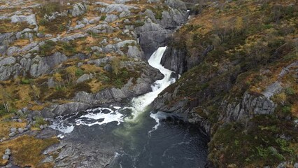 Sticker - Ascending drone shot of Manafossen waterfall along the river Manaana in Gjesdal municipality, Norway