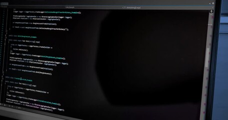hacker scrolls program code on notebook computer, cyber security concept