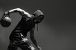 © studioworkstock - Dynamic black and white image of a hooded basketball player in action, showcasing athleticism and intensity.
