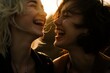 © studioworkstock - Close-up of two young women laughing joyfully in the sunlight, capturing a moment of happiness, friendship, and carefree spirit.