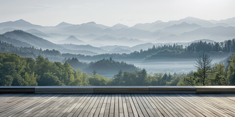 View from the empty wooden terrace over the mountains and forest in summer morning fog. Nature relax wallpaper.