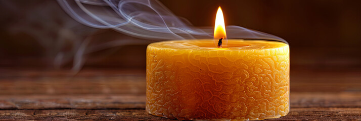 Wall Mural - A candle is lit and the smoke is rising