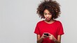© esp2k - A woman with curly hair is looking at her cell phone