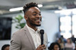 © AI_images - A Black entrepreneur, hosting a startup pitch competition for minority-owned businesses, providing a platform for aspiring entrepreneurs to showcase their ideas and access funding and mentorship
