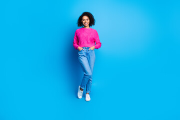 Sticker - Full size photo of nice young girl posing empty space wear pink sweater isolated on blue color background