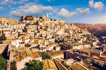 Wall Mural - Panoramic view of the ancient town of Matera (Sassi di Matera) in a beautiful autumn day, Basilicata, southern Italy. Stunning view of the village of Matera. Matera is a city on a rocky outcrop.