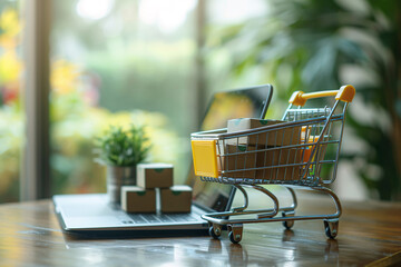Wall Mural - A laptop computer and a shopping cart with a green plant and parcel box inside, ecommerce concept