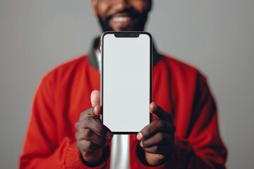 Wall Mural - Happy Man Holding Smartphone Mockup, Man Shows Smartphone Screen with Copy Space, Advertising Template