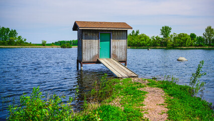 Wall Mural - Bird watching house on the lake in Hartford, Minnehaha County, South Dakota: The wildlife conservation area of the midwestern prairie land