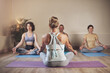 © peopleimages.com - Yoga, instructor and group of people for meditation, breathe work and class in wellness studio. Zen, peace and holistic healing for mental health, female coach and exercise for spiritual energy