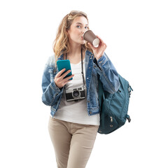 happy young woman tourist traveler with smartphone, holding paper cup and drinking coffee, wearing a