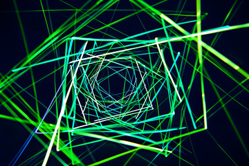 Wall Mural - Mesmerizing neon lines intersecting in a glowing green and blue pattern. A captivating visual on black background.