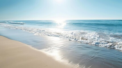 Wall Mural - tranquil beach scene with glistening sand and calm ocean waves serene landscape photography