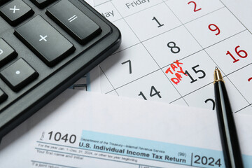 Wall Mural - Calendar with date reminder about tax day, documents, pen and calculator, closeup