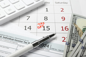 Wall Mural - Calendar with date reminder about tax day, documents, pen, calculator and money, closeup