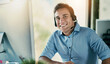 © peopleimages.com - Customer service, confidence and portrait of happy man with headset virtual assistant consulting at help desk. Phone call, conversation and advice at callcenter for telemarketing, sales or support