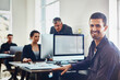 © peopleimages.com - Man, portrait and happy in office with computer for research and development for company with technology. Business people, conversation and collaboration for problem solving and email proposal.