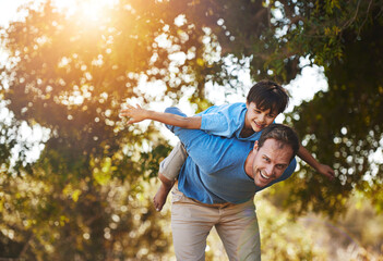 Portrait, father and piggyback child at park for laugh, care or family bonding together in nature. Smile, dad and carry kid at garden for airplane game, support or play on summer holiday for freedom