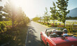 © peopleimages.com - Couple, convertible and driving road trip or travel journey to California vineyard, adventure or transportation. People, nature and tourism holiday for explore together in retirement, morning or love