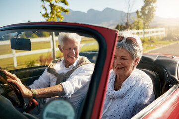 Canvas Print - Old couple, road trip and convertible car in nature vineyard for retirement travel, marriage or adventure. Man, woman and vehicle transportation in California for explore trip, romance or journey