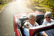 © peopleimages.com - Senior, couple and driving convertible car for holiday road trip or countryside retirement, transportation or summer. Man, woman and old people on travel journey in Napa country, exploring or happy