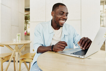 Wall Mural - Computer young african modern person technology adult men male laptop black sitting business happy