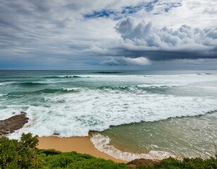 Wall Mural - ocean breaks on shore with dramatic sky