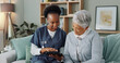© peopleimages.com - Senior, woman and caregiver with tablet or discussion in nursing home for patient test results or explaining. Elderly, person and nurse with technology for health report or happy for client diagnosis