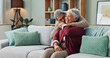 © peopleimages.com - Senior, couple and hug on couch with love for marriage, commitment and safety with security on weekend break. Man, woman and together on sofa for bonding with comfort, close and trust with romance.