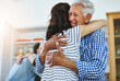 © peopleimages.com - Elderly, father and woman hug in home with love, care and support in retirement from family. Senior, man and embrace dad at reunion on holiday, vacation or person with happiness and kindness in house