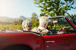 © peopleimages.com - Old couple, road trip and convertible car countryside driving in vineyard or retirement travel, marriage or adventure. Man, woman and transportation in Napa valley or exploring, nature or journey