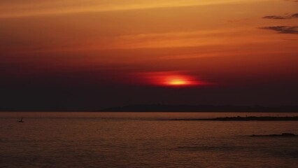 Wall Mural - landscape with sunset sun and clouds over sea, time lapse 4k