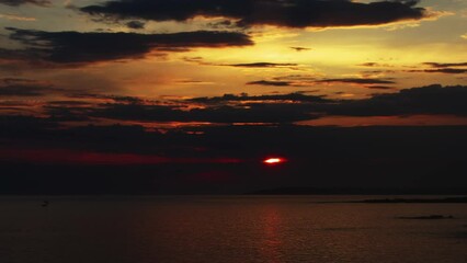 Wall Mural - landscape with sunset sun and clouds over sea, time lapse 4k