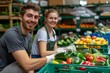 © Yuliia - Young Caucasian Couple Volunteers Together to Pack Fresh Produce for Needy in Green Boxes