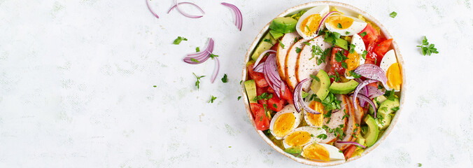 Wall Mural - Healthy cobb salad with chicken, avocado, tomato, red onions and eggs. American food. Top view, banner