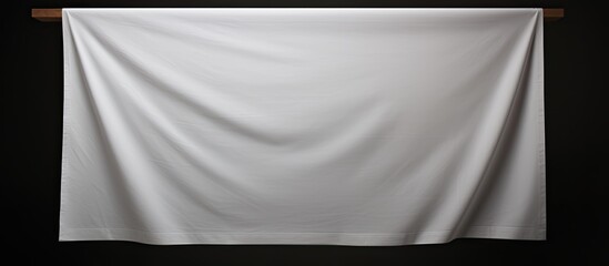Aufkleber - A white sheet with copy space image held vertically against a dark background