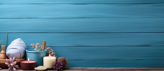 Aufkleber - Blue wooden background with a spa set creating a beauty concept image. Creative banner. Copyspace image