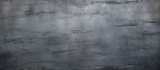 A copy space image featuring a textured grey steel surface as a background