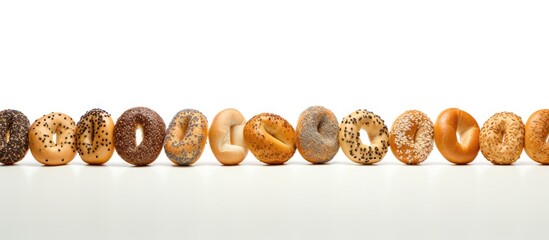 Wall Mural - a copy space image of bagels arranged on a table with a clean and plain white background