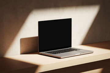 Wall Mural - apple macbook pro on the wooden desk on a plaster background