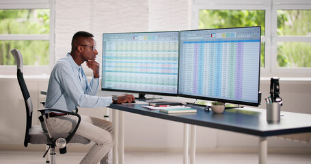 Wall Mural - Data Analyst African Man Using Spreadsheet