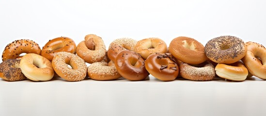 Wall Mural - a copy space image of bagels arranged on a table with a clean and plain white background