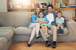 © peopleimages.com - Family, bonding and parents with children, couch and relax in living room, smile and house. Home, mom and dad with kids, together and embrace for break in apartment, happy and portrait with love