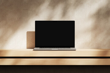 Wall Mural - apple macbook pro on the wooden desk on a plaster background