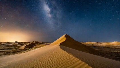 Wall Mural - A desert landscape with towering sand dunes under a starlit sky.
