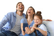 © ty - Beautiful young family with little child taking a selfie with a smartphone at home on the couch on a transparent background