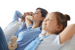 © ty - Relaxed young family resting and dreaming about new home on comfortable sofa together on a transparent background