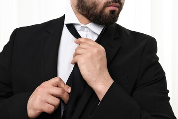 Wall Mural - Businessman in suit and necktie indoors, closeup