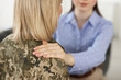 © New Africa - Psychotherapist working with military woman in office, closeup